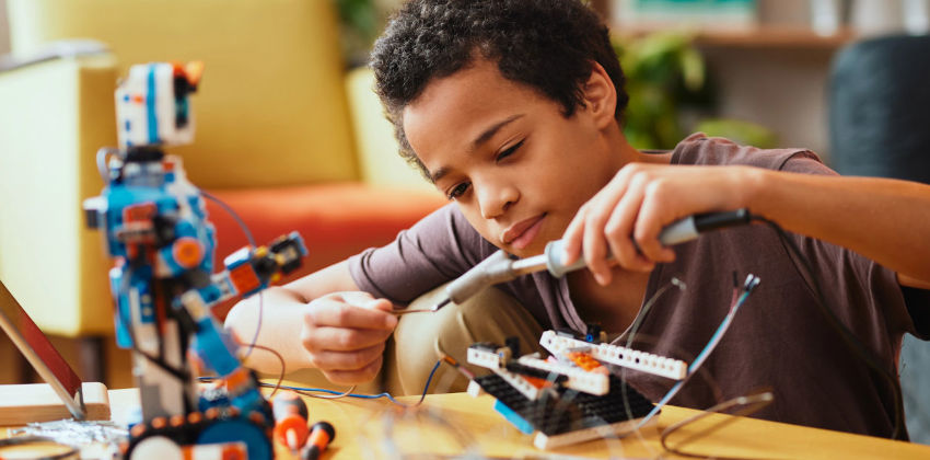 Child working on a robot