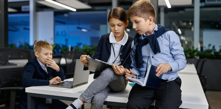 Children pretending to work in an office