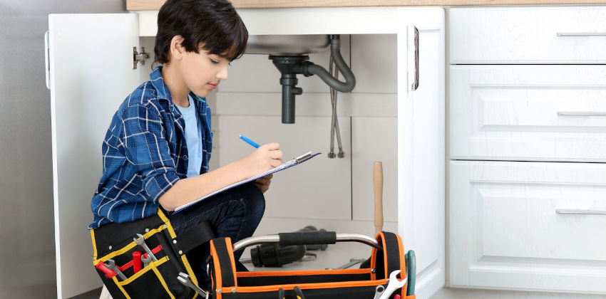 Child pretending to work as a plumber