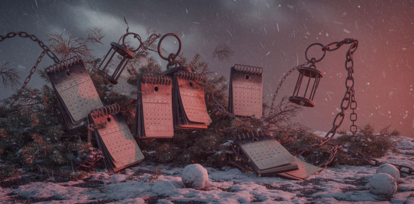 Present present sitting on a wooden table, next to holiday decorations