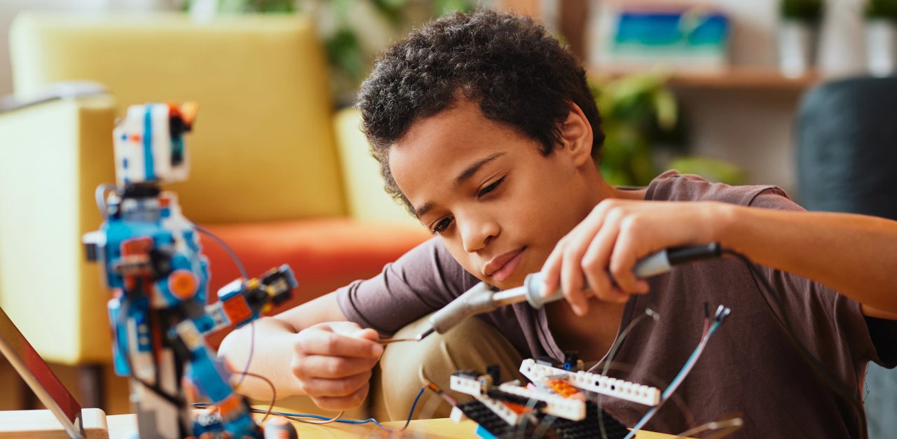 Child working on a robot